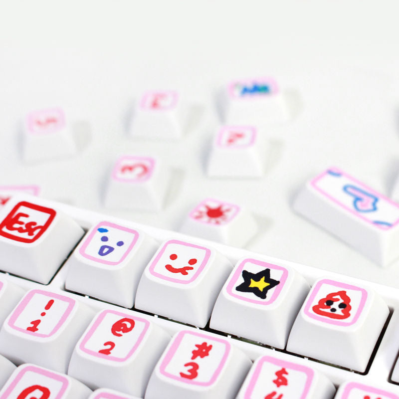 Bring a splash of creativity to your keyboard with AiheyStudio’s graffiti-style custom keycaps in pink and blue