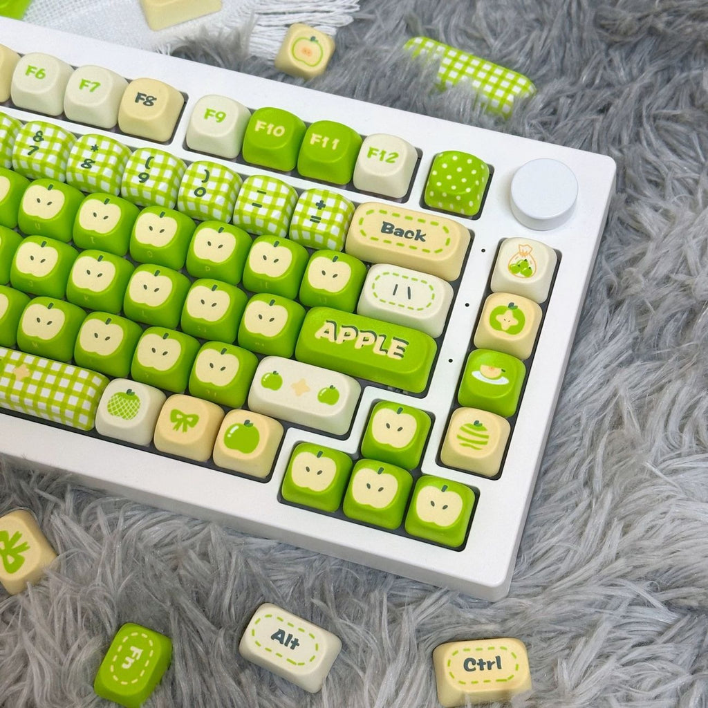 Cute green apple themed keycaps with cartoon fruit illustrations for custom mechanical keyboard setup