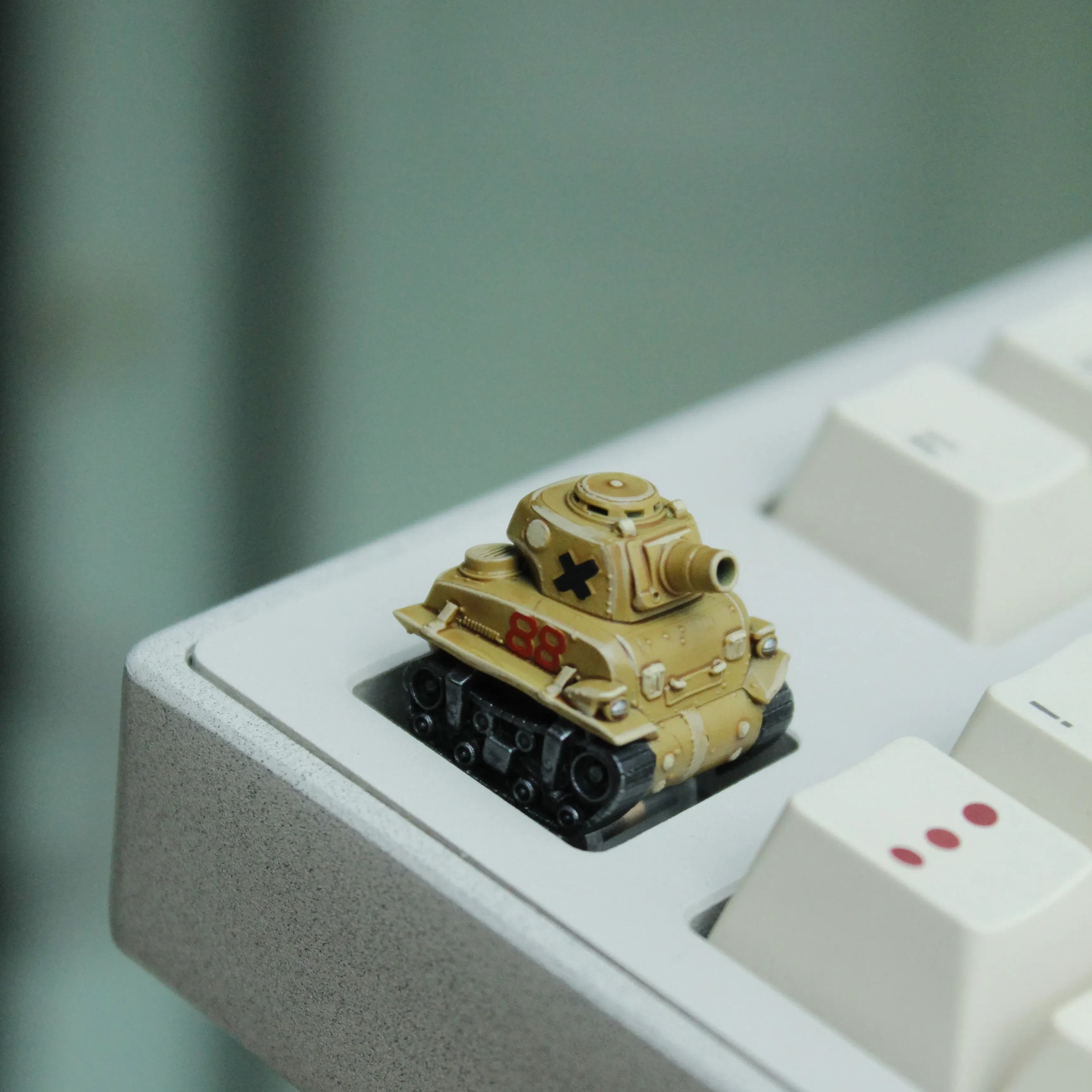 Gaming keyboard tank artisan keycap with miniature 3D vehicle design for retro themed setups