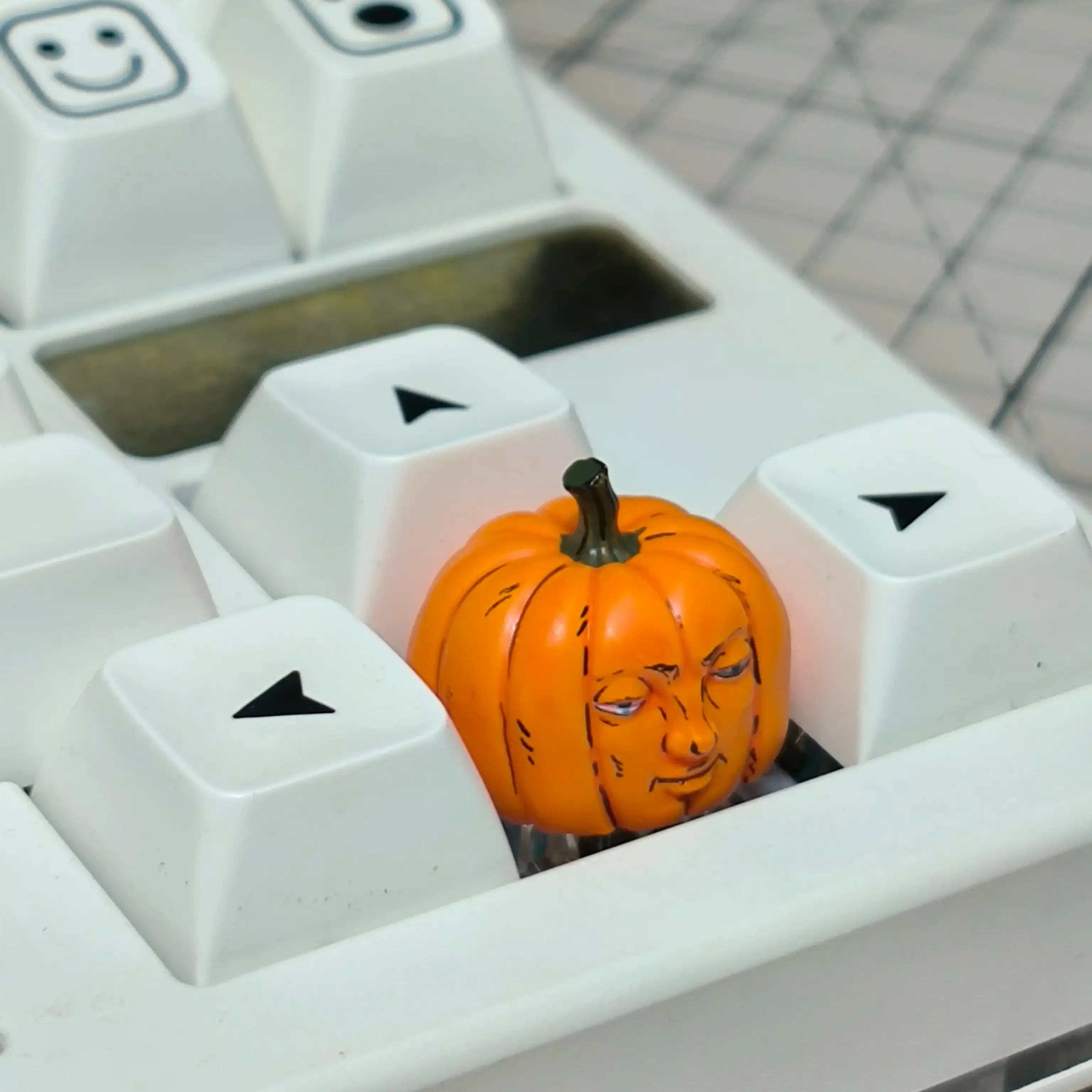 Human face pumpkin artisan keycap installed on a custom mechanical keyboard