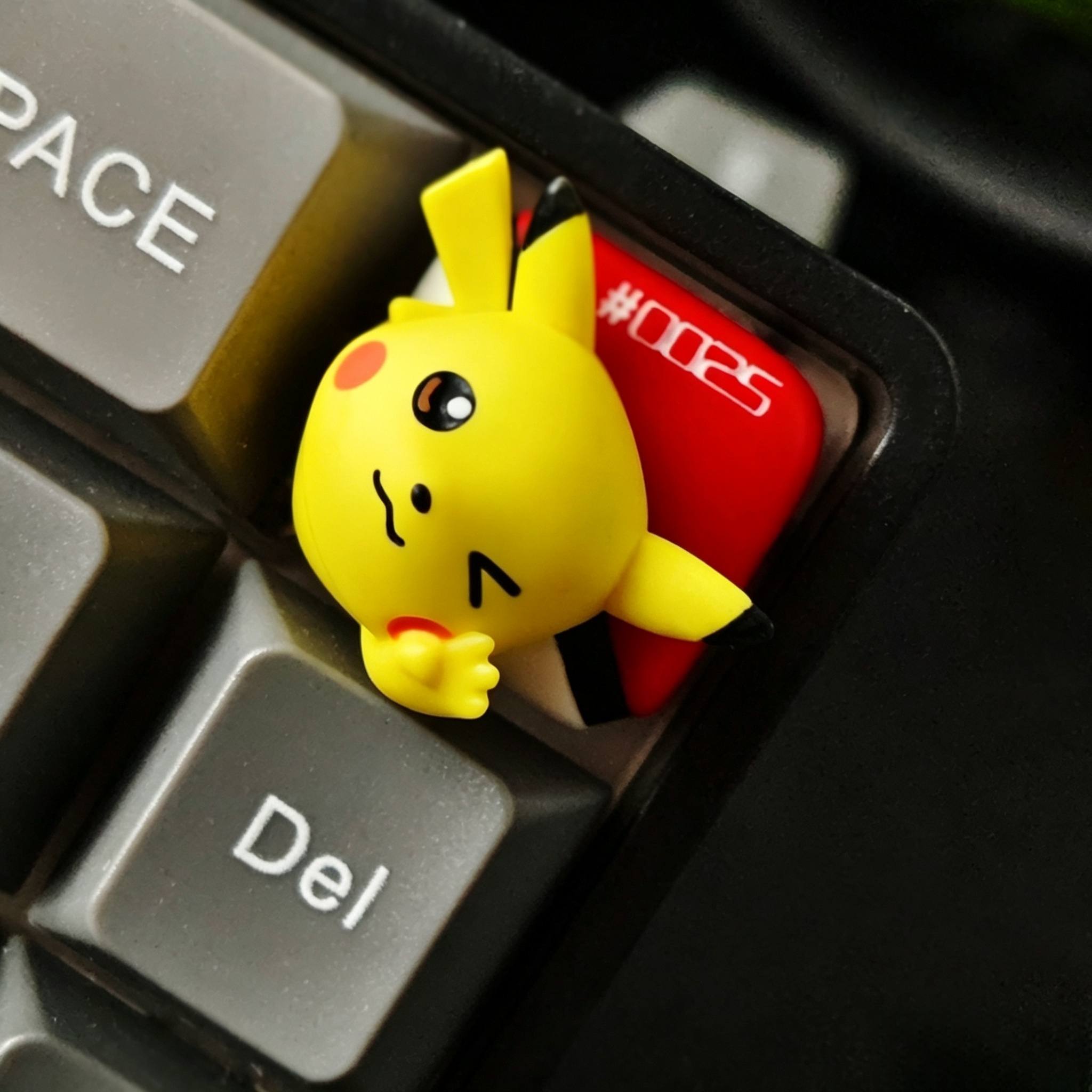 Pokemon-artisan-keycap-installed-on-mechanical-keyboard-for-personalized-gaming-and-desk-setup