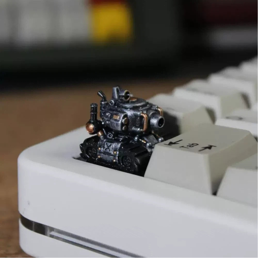 Silver tank artisan keycap with detailed miniature armored vehicle design for custom mechanical keyboards