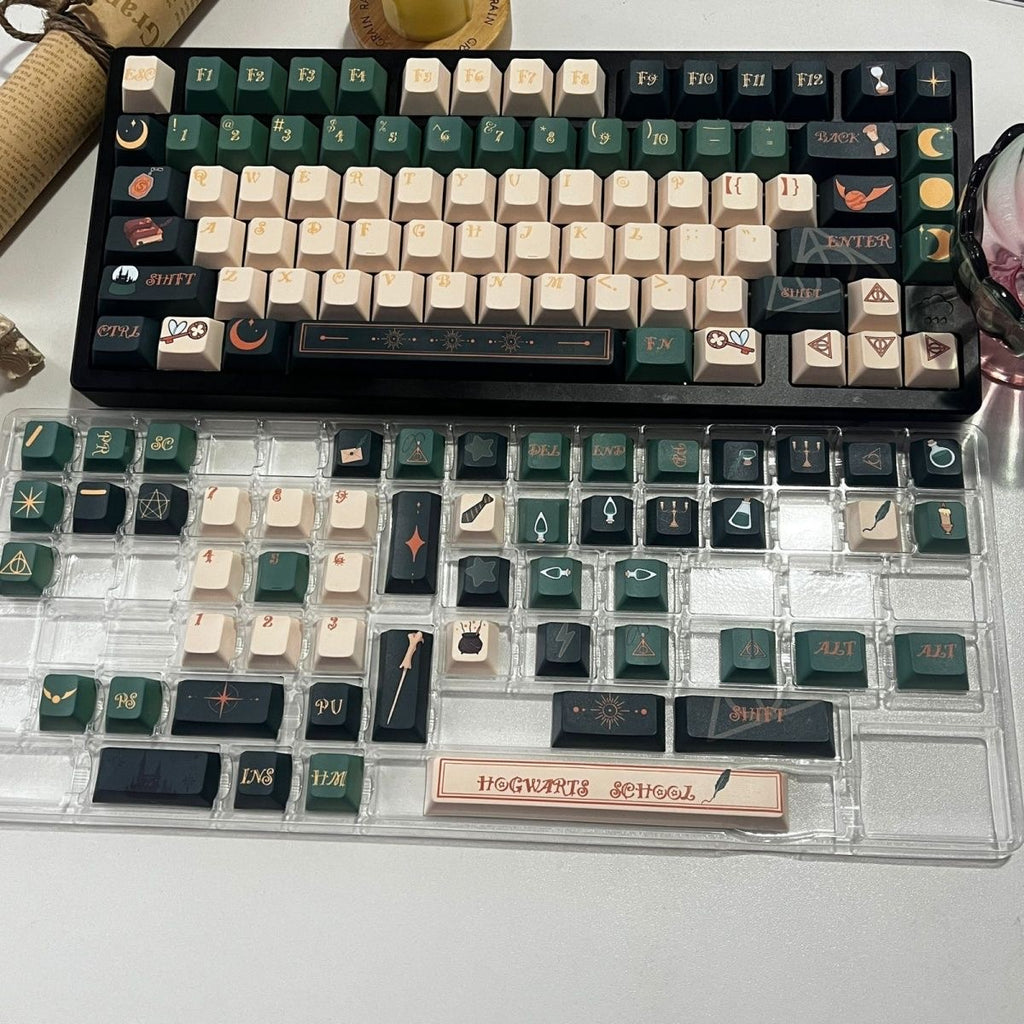 Close-up of aiheystudio’s Slytherin keycaps with snake emblem and deep green color on durable PBT material.

