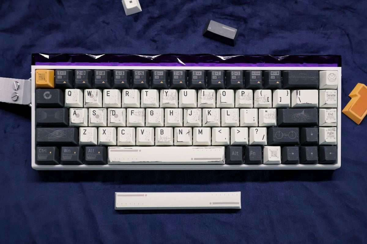 Space themed mechanical keyboard setup featuring futuristic keycaps inspired by astronauts, cosmic exploration, and sci-fi technology